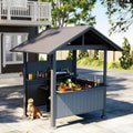Grey gable-roof grill gazebo with storage shelves on a patio