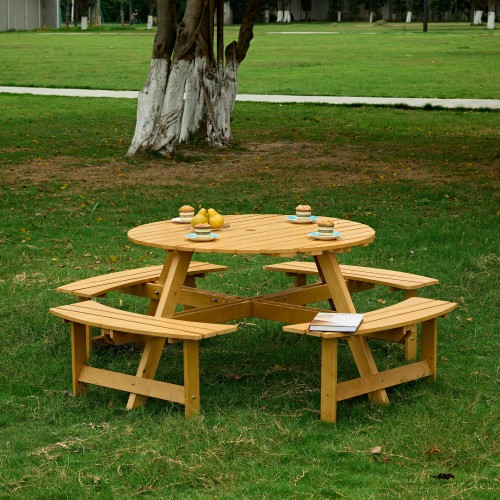 Round wooden picnic table with four built-in benches and umbrella hole