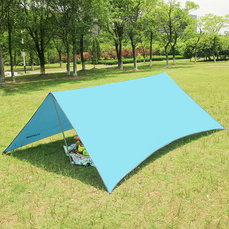 Lightweight shade canopy tent set up on a beach