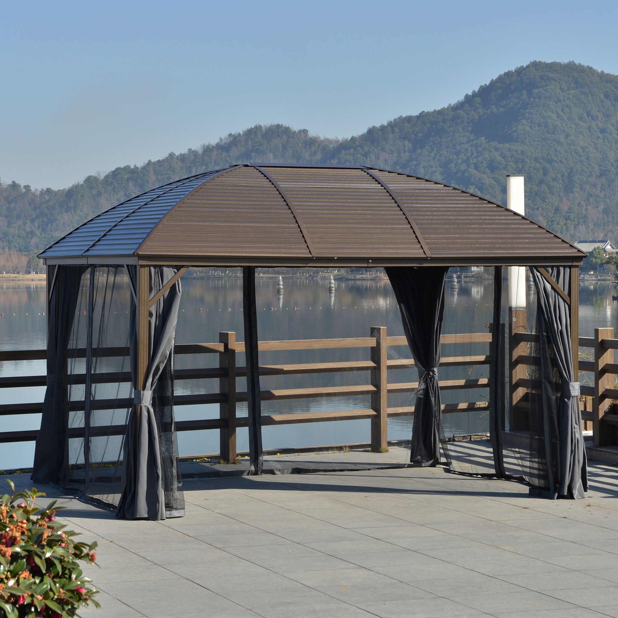 Grey 10 by 13 foot hardtop gazebo with mosquito netting and privacy curtains