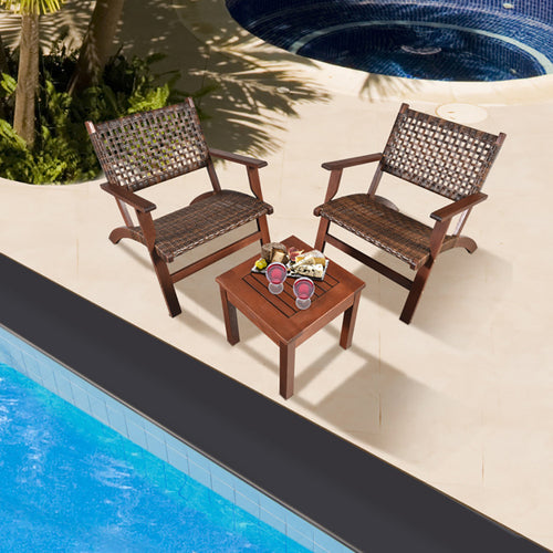 Three-piece wood and rattan patio set with two chairs and a side table