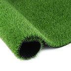 Artificial grass runner rug rolled out on a patio